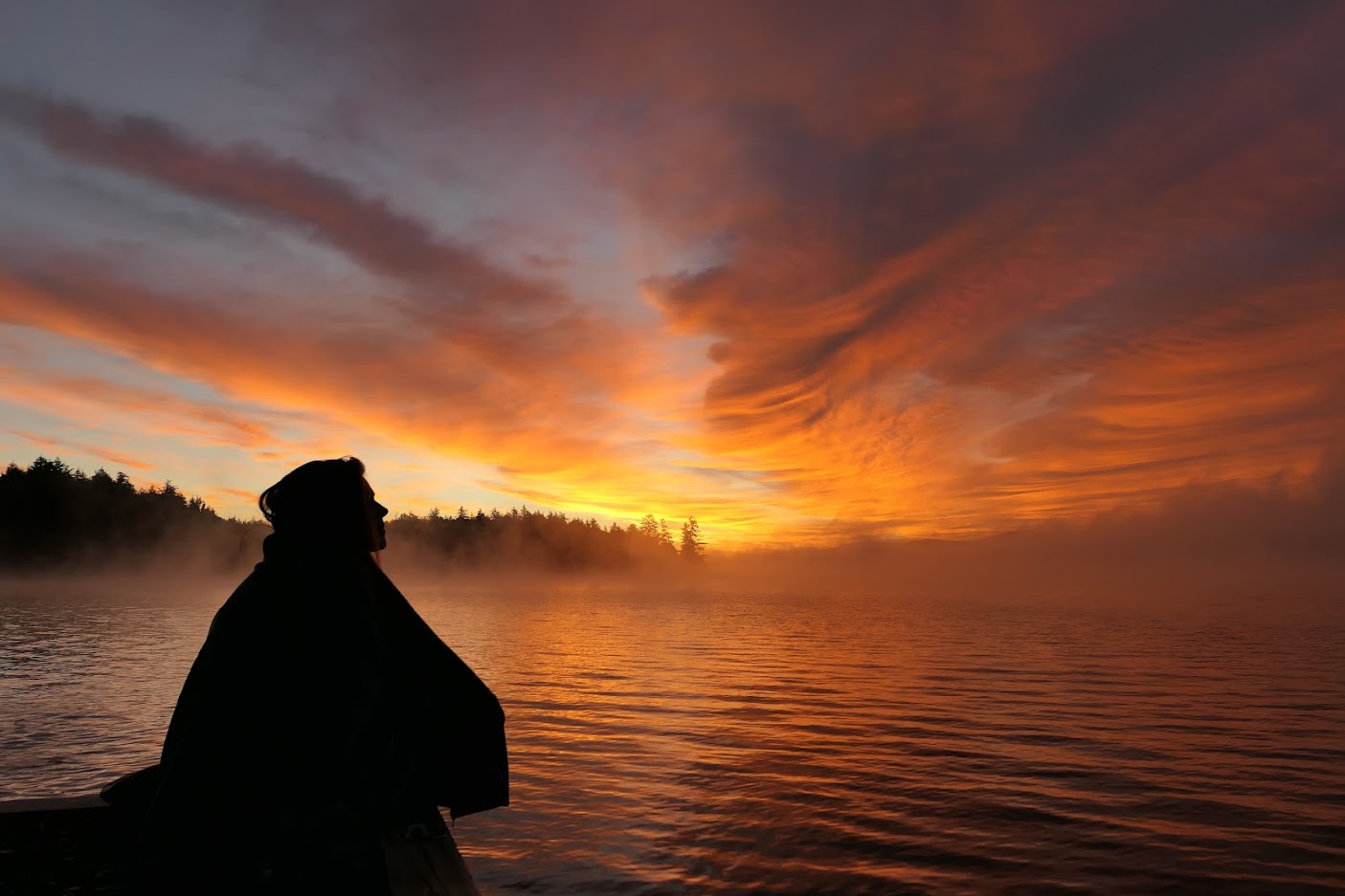International student observing beautiful sunset at Raquette Lake